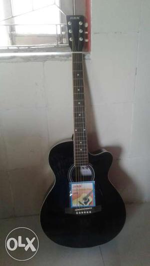 Black colour acoustic guitar "Jimm company"