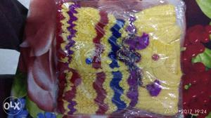 Children's Yellow, Purple, Red, And Blue Crochet Vest