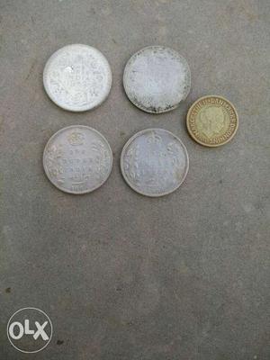Four Round Silver-color And One Gold-color Coins