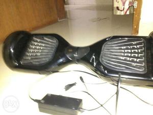 Hover Board with charger and hardly 20 days used only some