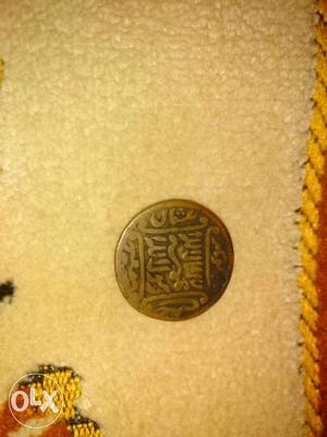 Islamic coin kalma_e_tayyab written on it.