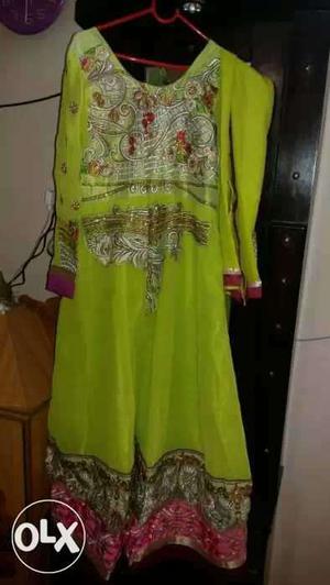 Long heavy looking anarkali in lime green color