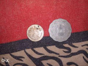 One Round And One Scalloped Coins