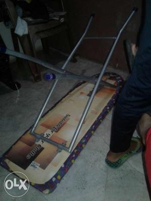 Purple And Brown Ironing Board