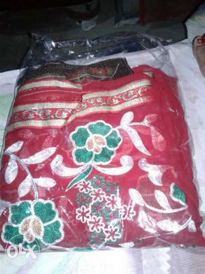 Red And Green Floral Textile With Pack