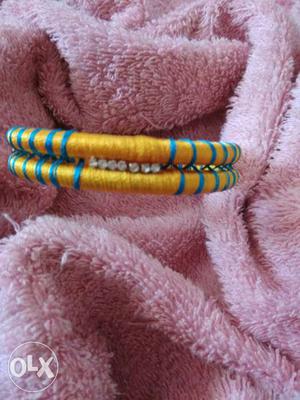 Two Brown And Blue Silk Threaded Bangles