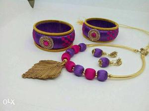 Two Purple And Red Threaded Bangles