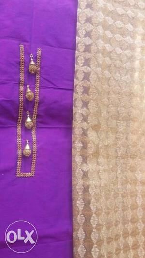 Violet dress with golden stone work in neck and