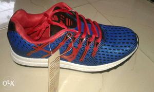 Blue And Red Running Shoe
