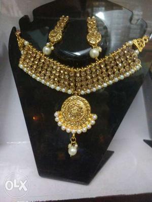 Gold Pendant Necklace And Pair Of Dangling Earrings