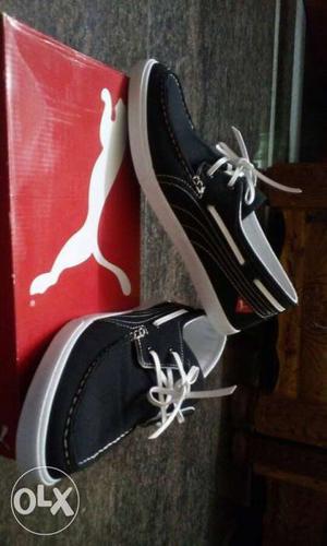 Pair Of Black-and-white Boat Shoes