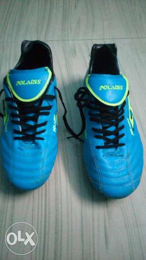 Pair Of Blue-and-green foot ball boots suze 6