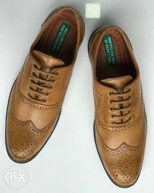 Pair Of Brown Leather Wingtip Oxford Shoes