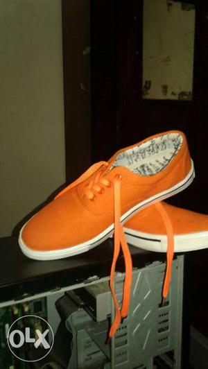 Pair Of Orange Low-top Sneakers
