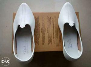Pair Of White Leather Flat Shoes