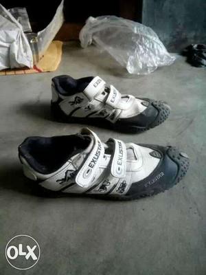 Pair Of White-and-black Exustar Bike Shoes