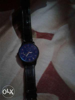 Round Blue Chronograph Watch With Black Leather Strap