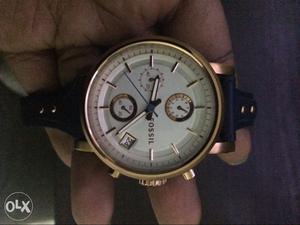 Round Gold Fossil Chronograph Wrist Watch With Black Strap