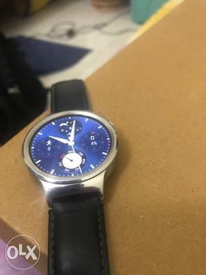 Round Silver-colored And Blue Chronograph Watch With Black