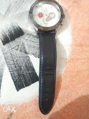 Round Silver-colored Chronograph Watch With Black Leather
