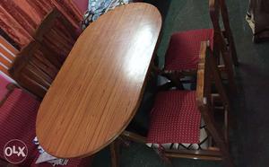4 seater wooden dining table. Chairs with