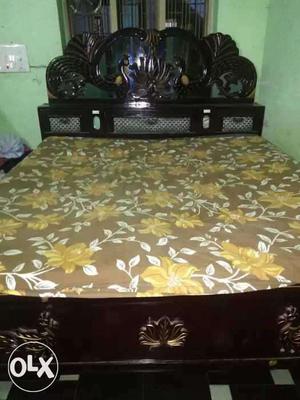 Brown Wooden Upholstered Bed With Yellow And Brown Floral