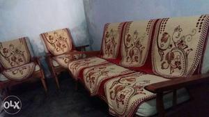 Get 5 seater wooden sofa along with sofa cover and one tea