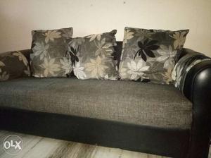 Gray Fabric Sofa And Three Throw Pillows