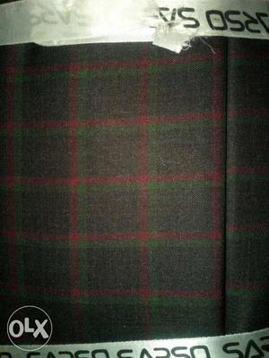 Gray, Green, And Red Plaid Textile