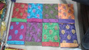 Green, Blue, Purple, Red, And Black Floral Textiles