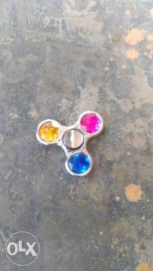 Grey, Blue, Pink, And Yellow 3-bladed Fidget Spinner