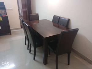 Rectangular Brown Wooden Table With Parsons Chairs