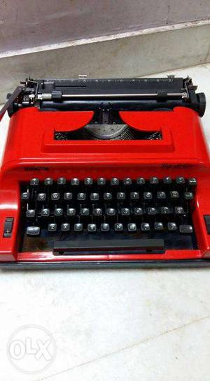Red color portable typewriter