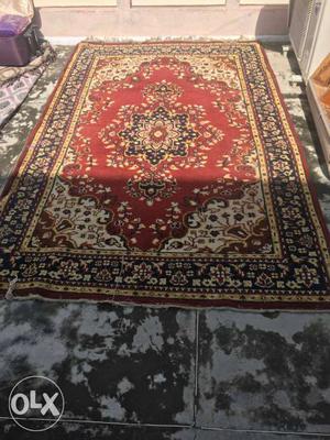 Red colour carpet in very good condition