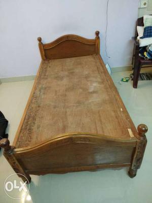 Single wooden cot along with 2 mattresses and 2