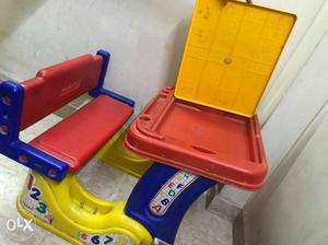 Toddler's Red, Blue, And Yellow Plastic Desk With Chair