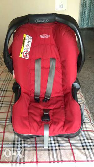 Baby's Red And Black Graco Booster Seat