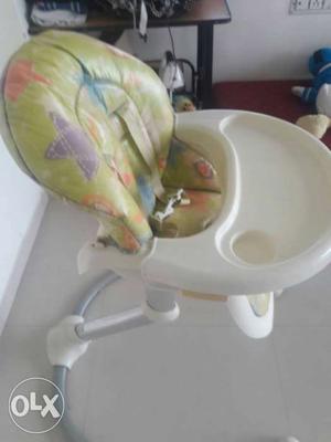 Baby's White And Green Feeding Chair