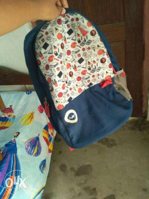 Blue, White And Orange Backpack