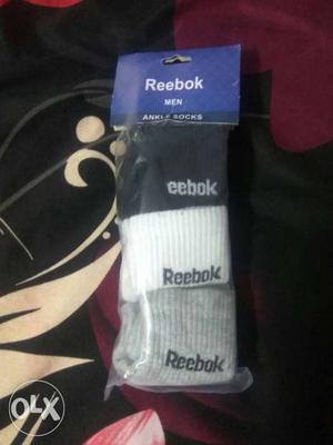 Black, White, And Gray Reebok Socks