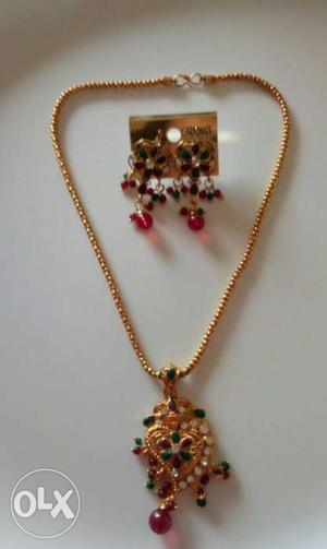 Gold, Red, And Green Pendant Necklace And Pair Of Earrings