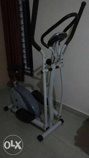 Gray And White Elliptical Trainer