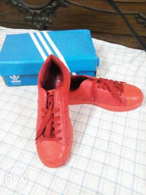 Pair Of Red Adidas Stan Smith