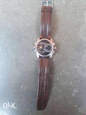 Round Silver Bezel Chronograph Watch With Brown Leather