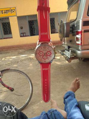 Round White And Red Face Chronograph Watch