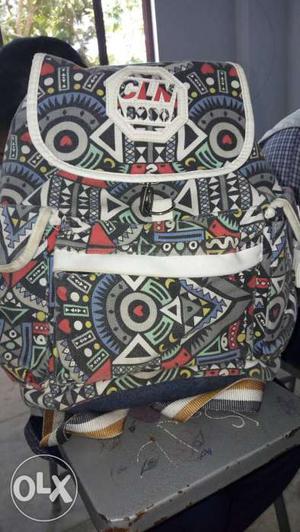 White And Multicolored Backpack