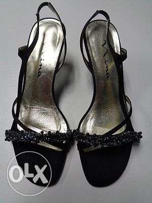 Black sandal. 3 inch heel height. Brand is NINA.
