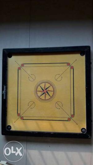 Brown And White Carrom Board
