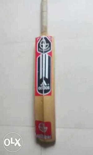 Brown, Red, Black, And White Adidas Cricket Bat