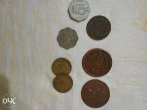 Seven Gray And Copper Coins